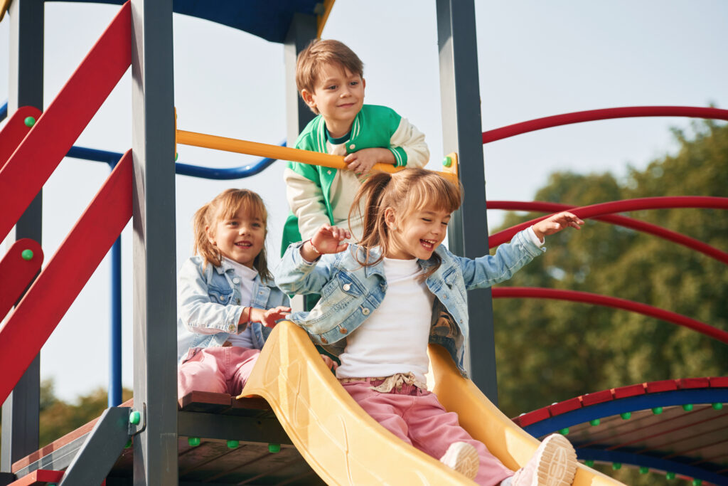 On the playground. Kids are having fun together.