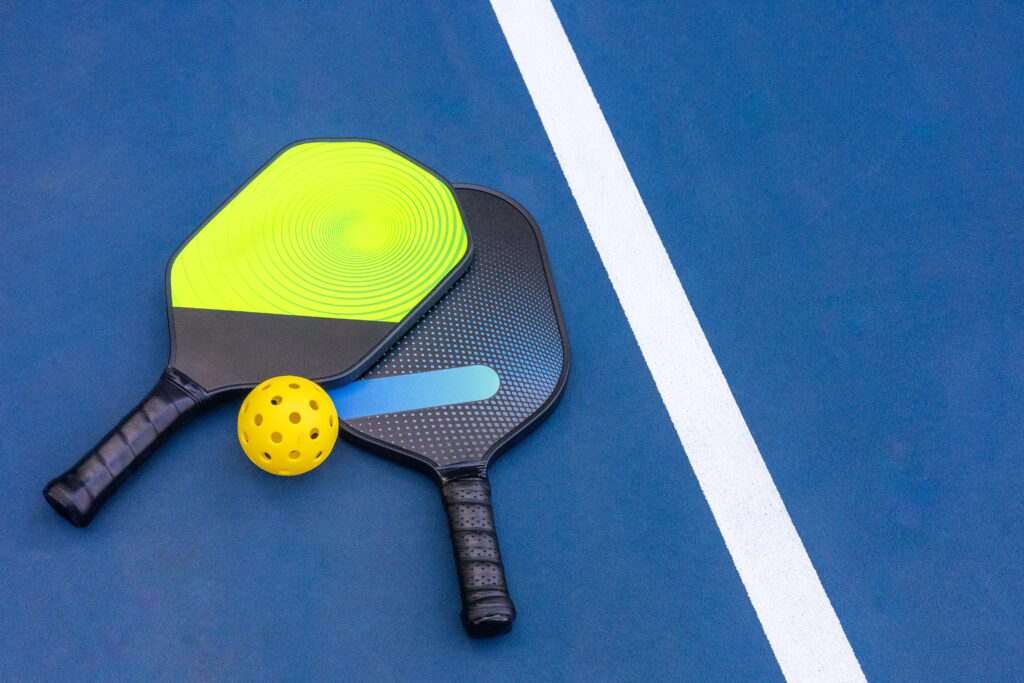A Pickleball Racquet's on blue court